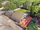 Aerial view of enclosed pool with deck and outdoor seating area at 3905 Osprey Pointe Cir, Winter Haven, FL 33884