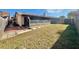 Backyard featuring a spacious grassy area and a partially screened patio at 4016 Cypress S Lndg, Winter Haven, FL 33884