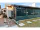 Backyard with screened in porch and patio steps at 4016 Cypress S Lndg, Winter Haven, FL 33884