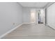 Bedroom featuring light gray walls, light-colored flooring, and ensuite bath at 4016 Cypress S Lndg, Winter Haven, FL 33884