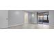 Bright bedroom with light gray walls, light-colored flooring, and a screened-in porch at 4016 Cypress S Lndg, Winter Haven, FL 33884