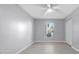 Light-filled bedroom featuring hardwood floors and a ceiling fan at 4016 Cypress S Lndg, Winter Haven, FL 33884