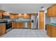Spacious kitchen with stainless steel appliances and ample oak cabinetry at 4016 Cypress S Lndg, Winter Haven, FL 33884