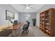 Cozy office with wood desk and bookshelf perfect for remote work at 4016 Cypress S Lndg, Winter Haven, FL 33884
