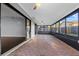 Enclosed sunroom with brick flooring and large windows at 4016 Cypress S Lndg, Winter Haven, FL 33884