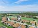 An aerial view of a well-maintained neighborhood with golf course, lake and pool at 4088 Dunmore Dr, Lake Wales, FL 33859