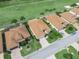 An aerial view of houses with well-maintained lawns and a nearby golf course at 4088 Dunmore Dr, Lake Wales, FL 33859