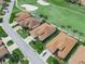 An aerial view of some houses with their well-maintained lawns near a golf course at 4088 Dunmore Dr, Lake Wales, FL 33859