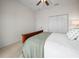 A cozy bedroom featuring neutral carpeting, a ceiling fan, and a closet at 4088 Dunmore Dr, Lake Wales, FL 33859
