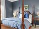 This bedroom features a four poster bed with carved columns and classic decor at 4088 Dunmore Dr, Lake Wales, FL 33859