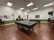 Comfortable billiards room with pool tables, chairs, and ample lighting for enjoyable play at 4088 Dunmore Dr, Lake Wales, FL 33859