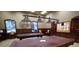 Upscale billiard room with two pool tables, comfortable seating, and natural light at 4088 Dunmore Dr, Lake Wales, FL 33859
