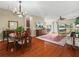 Elegant dining room with hardwood floors, chandelier, and ample space for entertaining at 4088 Dunmore Dr, Lake Wales, FL 33859