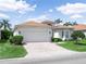 Charming single-Gathering home with a well-manicured lawn and brick driveway at 4088 Dunmore Dr, Lake Wales, FL 33859