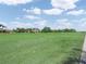 Beautiful Florida golf course with lush green grass under blue skies at 4088 Dunmore Dr, Lake Wales, FL 33859