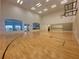 Large gymnasium with basketball court, high ceilings, and ample natural light at 4088 Dunmore Dr, Lake Wales, FL 33859