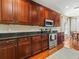 Gourmet kitchen with stainless steel appliances, granite countertops, and custom wood cabinetry at 4088 Dunmore Dr, Lake Wales, FL 33859