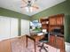 A home office with hardwood floors, closet and dark green accent walls at 4088 Dunmore Dr, Lake Wales, FL 33859
