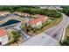 Aerial view of the townhome community and nearby pond at 438 Monroe Cir, Davenport, FL 33896