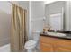 Cozy bathroom featuring a shower and tub combo with a single sink vanity at 438 Monroe Cir, Davenport, FL 33896