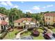 Exterior shot of neighborhood clubhouse with beautiful landscaping at 438 Monroe Cir, Davenport, FL 33896