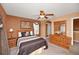 Comfortable bedroom featuring a ceiling fan, neutral color palette, and stylish wooden furniture at 451 Montara Dr, Davenport, FL 33897