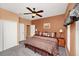 Spacious bedroom featuring a king-sized bed, ceiling fan, and closet at 451 Montara Dr, Davenport, FL 33897