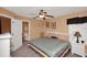 Bedroom featuring a bed, mounted television, window with attractive valance and ensuite bathroom access at 451 Montara Dr, Davenport, FL 33897