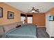 Comfortable bedroom featuring two windows, neutral color palette, and stylish dresser at 451 Montara Dr, Davenport, FL 33897