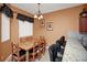 Cozy dining area featuring a wooden table with seating for six and a breakfast bar with seating for four at 451 Montara Dr, Davenport, FL 33897