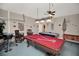Fun game room with a pool table, air hockey, foosball table, and bar for entertaining guests and Gathering at 451 Montara Dr, Davenport, FL 33897
