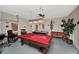 Fun game room with a pool table, air hockey, foosball table, and bar for entertaining guests and Gathering at 451 Montara Dr, Davenport, FL 33897