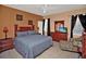 Comfortable primary bedroom with ceiling fan, tile floors, dresser and mirror at 451 Montara Dr, Davenport, FL 33897