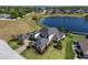 Aerial view showing the expansive estate with a lake view, lush landscaping, and a detached garage at 4717 Emerald Palms Ct, Winter Haven, FL 33884
