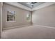 Large bedroom with neutral carpeting, recessed lighting, and large windows at 4717 Emerald Palms Ct, Winter Haven, FL 33884