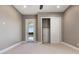 Neutral bedroom featuring sliding door, large closet, and ceiling fan at 4717 Emerald Palms Ct, Winter Haven, FL 33884