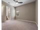 Spacious bedroom with neutral carpet and a bathroom with a large tiled shower at 4717 Emerald Palms Ct, Winter Haven, FL 33884