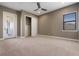 Bedroom with neutral carpet, ceiling fan, and closet for storage at 4717 Emerald Palms Ct, Winter Haven, FL 33884
