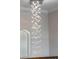 Close up of chandelier in open landing at 4717 Emerald Palms Ct, Winter Haven, FL 33884
