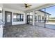 Covered lanai with access to an outdoor kitchen through a glass door at 4717 Emerald Palms Ct, Winter Haven, FL 33884