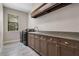 Laundry room featuring a sink, dark wood cabinets and stainless steel washer and dryer at 4717 Emerald Palms Ct, Winter Haven, FL 33884