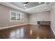 Spacious living room with dark wood floors, recessed lighting, and a stylish wet bar area at 4717 Emerald Palms Ct, Winter Haven, FL 33884