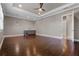 Spacious living room with dark wood floors, recessed lighting, and a stylish wet bar area at 4717 Emerald Palms Ct, Winter Haven, FL 33884