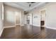 Large main bedroom featuring tray ceiling, wood floors, and access to walk-in closet and bathroom at 4717 Emerald Palms Ct, Winter Haven, FL 33884