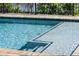 Inviting pool entry with steps and detailed tile trim work at 4717 Emerald Palms Ct, Winter Haven, FL 33884