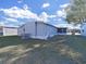 Backyard view of the gray home at 4986 Foxwood Lake Dr, Lakeland, FL 33810