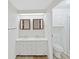 Bright bathroom featuring a dual vanity, modern lighting, stylish mirrors, and a separate shower area at 4986 Foxwood Lake Dr, Lakeland, FL 33810