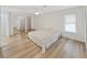 Primary bedroom with mirrored closets, wood floors, and lots of light at 4986 Foxwood Lake Dr, Lakeland, FL 33810