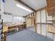 Unfinished garage with a pegboard, gray walls, and concrete floor offering ample space for storage or projects at 4986 Foxwood Lake Dr, Lakeland, FL 33810