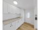 Bright eat-in kitchen featuring white cabinets and modern countertops at 4986 Foxwood Lake Dr, Lakeland, FL 33810